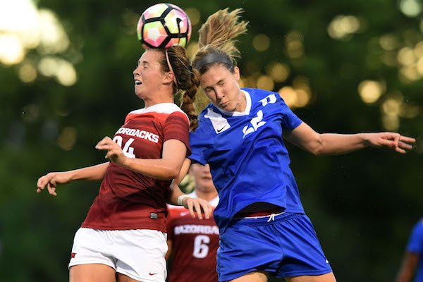Kayla Mckeon (24) of Arkansas goes up for the header in front of Duke defender Malinda Allen (22) Friday, August 26, 2016 during their game at Razorback field in Fayetteville.