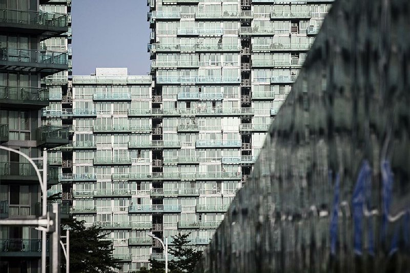 Residential buildings stand in Shenzhen, China, in August.