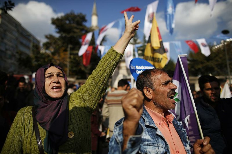 Supporters of the pro-Kurdish Peoples’ Democratic Party protest during an attempted march that was dispersed by police Sunday in Turkey’s capital, Ankara.