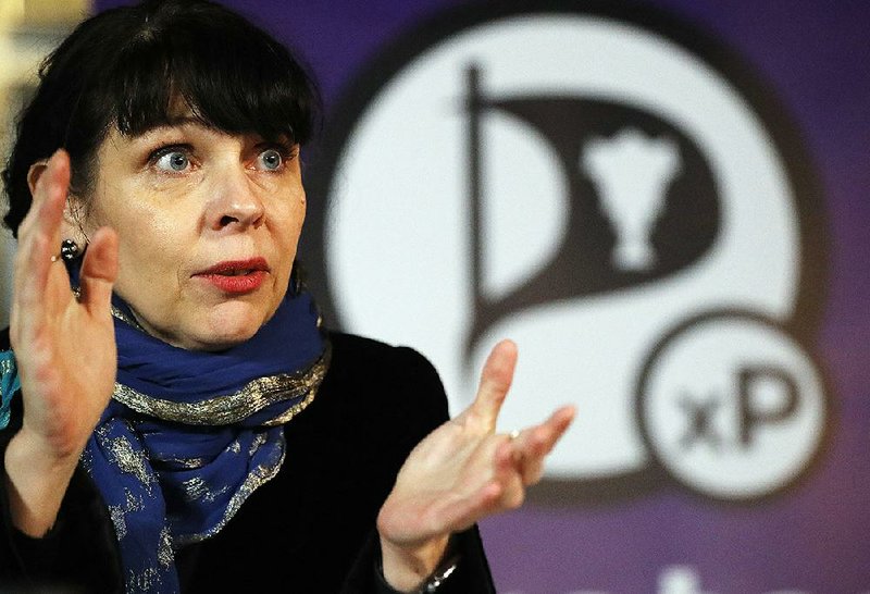 Birgitta Jonsdottir of the Pirate Party speaks Sunday at a news conference in Reykjavik, Iceland.