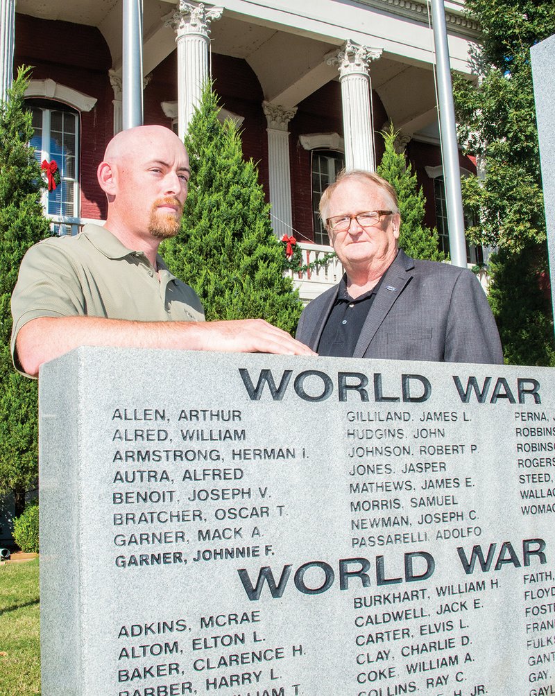 Michael John McCarty of Bald Knob, left, and Robert Scott Bell Jr. of Searcy will be inducted into the Arkansas Military Veterans’ Hall of Fame on Saturday in Little Rock. McCarty served in Iraq and Bell in Vietnam. The veterans are shown here at the White County war memorial at the courthouse in Searcy. The memorial is dedicated to local veterans who lost their lives in World War I, World War II and the Korean War. Bell’s father’s name is listed first under the Korea heading, although he served in World War II as well. Another monument dedicated to those who lost their lives in the Vietnam War is located on the other side of the courthouse.