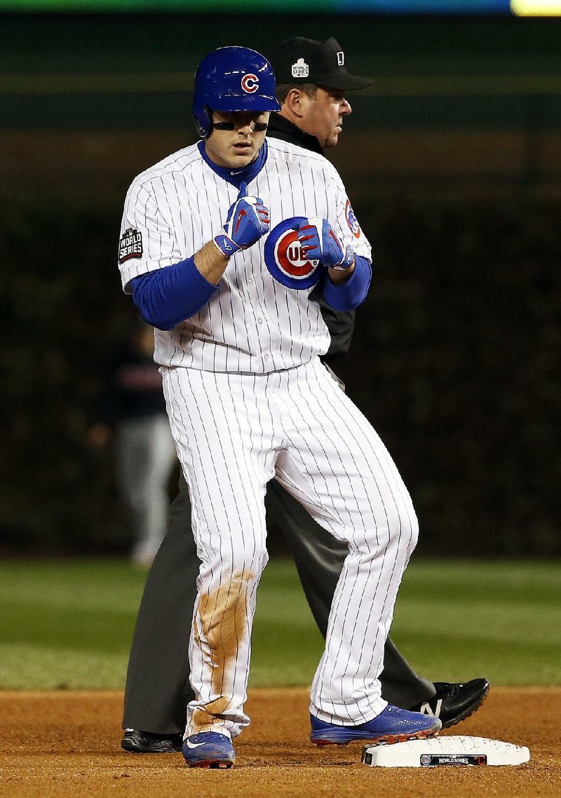 Chicago Cubs first baseman Anthony Rizzo shows off his quick hands after hitting a double during the fourth inning Sunday in Game 5 of the World Series in Chicago.