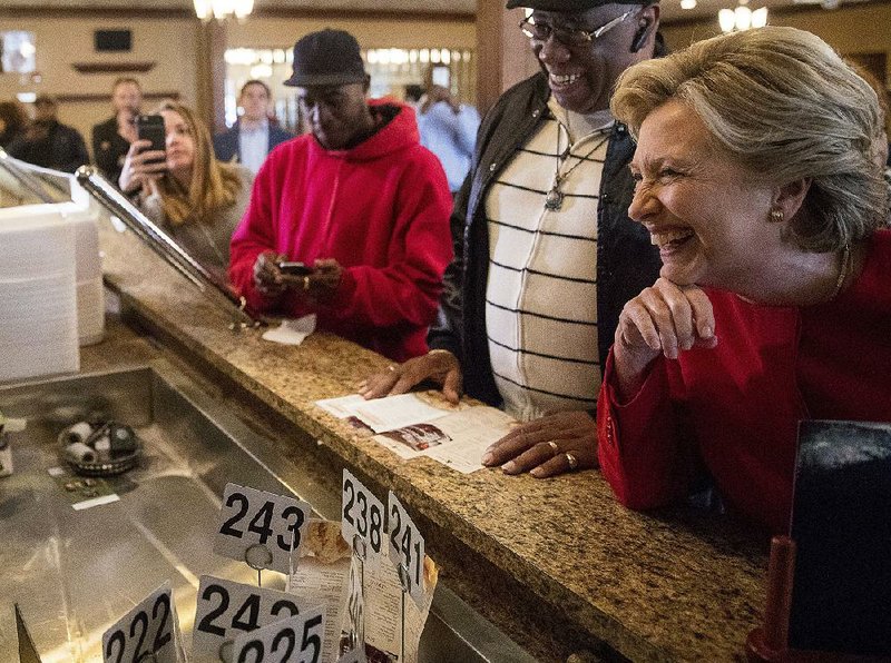 Hillary Clinton orders lunch Monday at Angie’s Soul Cafe in Cleveland while campaigning in the battleground state of Ohio.