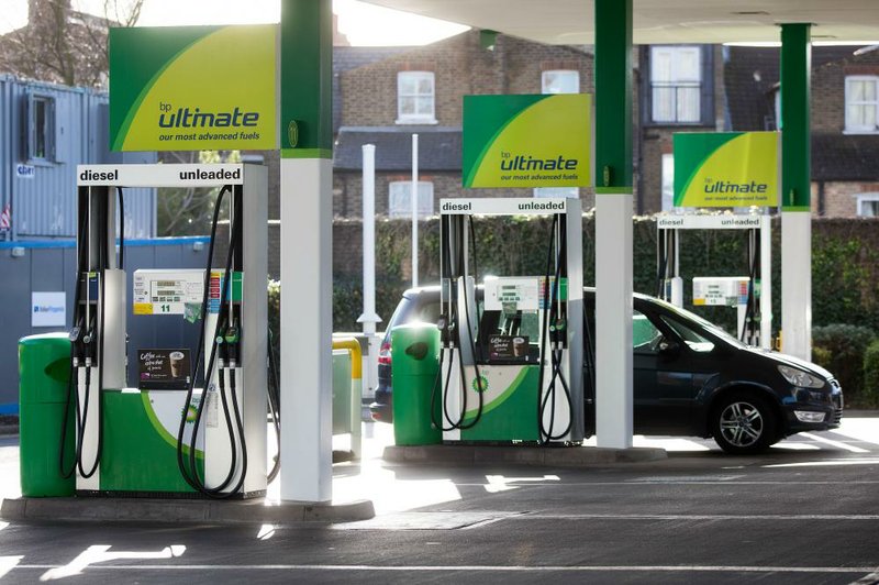 A motorist drives into a gas station operated by BP Plc in London, in February. BP’s earnings have fallen year-on-year for nine consecutive quarters, piling pressure on CEO Bob Dudley to rein in spending. 