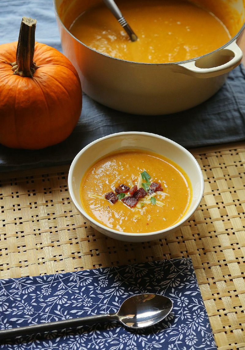 Beer and Cheddar Pumpkin Soup topped with crisp bacon and a sprinkle of cheese can be made with fresh or canned pumpkin. 