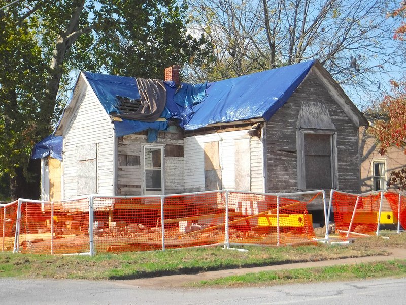 Photo by Randy Moll Renovation work is underway at an old home on north Rust Ave., in Gentry. With the roof covered, the old home was jacked up so that a new foundation can be built under the structure. The city council is hoping the building can be restored and used to house the city&#8217;s archives.