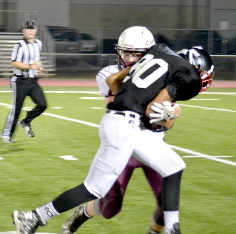 Blackhawk freshman Tristan Hall was tackled on his way to the goal Thursday night in the contest against Huntsville.