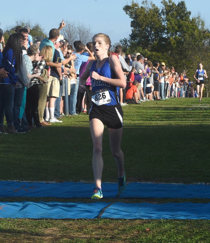 Halle Gilreath of Rogers High takes first place Tuesday in the 7A-West Conference cross country meet at Rogers High School..