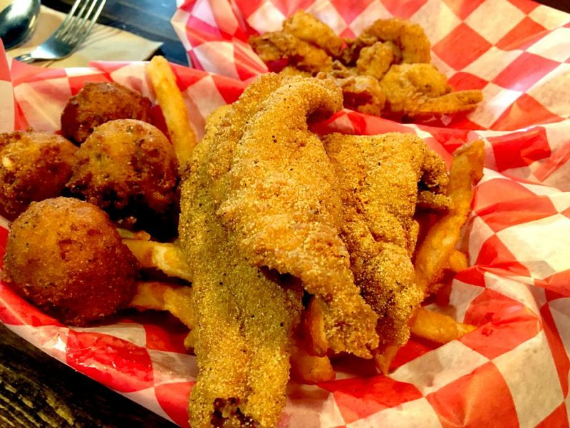 Extra hush puppies and beans came on the side of this Catfish-Shrimp Combo at Eat My Catfish in Little Rock’s Breckenridge Village.
