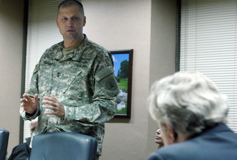 Maj. Gen. Alan Dohrmann, the leader of the state's National Guard, speaks at the state Capitol in Bismarck, N.D., to Gov. Jack Dalrymple, right, and other members of the state Emergency Commission while requesting an additional $4 million for the North Dakota Department of Emergency Services related to law enforcement costs associated with the Dakota Access Pipeline protests in Morton County. 