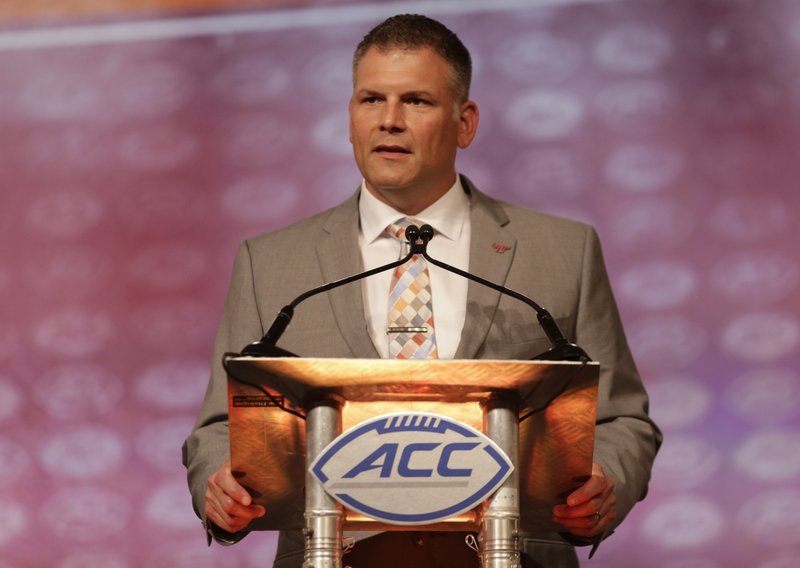 In this July 21, 2016, file photo, Virginia Tech head coach Justin Fuente speaks during a news conference at the Atlantic Coast Conference Football Kickoff in Charlotte, N.C. 