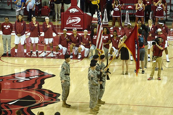 Arkansas basketball players kneel during the playing of the national anthem prior to an exhibition game against Oklahoma Baptist on Thursday, Nov. 3, 2016, in Fayetteville. 
