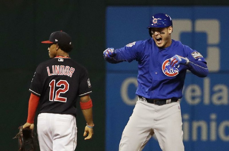 Chicago Cubs' Anthony Rizzo reacts after teammate Kris Bryant scored on Rizzo's hit during the fifth inning of Game 7 of the Major League Baseball World Series against the Cleveland Indians Wednesday, Nov. 2, 2016, in Cleveland. 