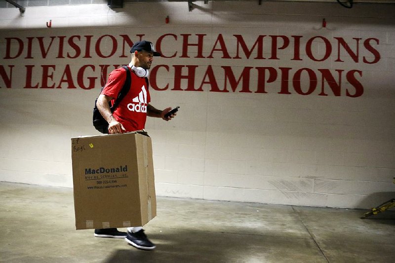 Cleveland Indians outfielder Coco Crisp leaves the Progressive Field locker room after clearing out his locker Thursday in Cleveland. The Indians lost Game 7 of the World Series, 8-7, to the Chicago Cubs on Wednesday.The Indians weren’t supposed to be playing in October, much less November, so the players took pride in going the distance. 