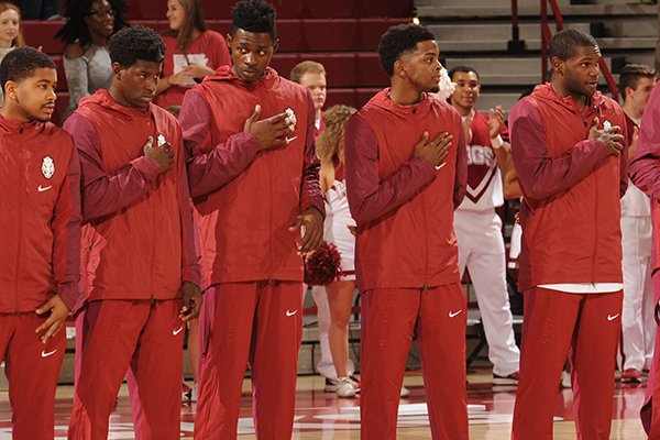 Arkansas' players stand during the national anthem before play against Emporia State's Friday, Nov. 4, 2016, during the first half of play in Bud Walton Arena in Fayetteville. 