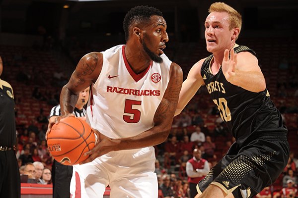 Arkansas' Arlando Cook (5) looks to drive around Emporia State's Josh Pedersen Friday, Nov. 4, 2016, during the first half of play in Bud Walton Arena in Fayetteville. 