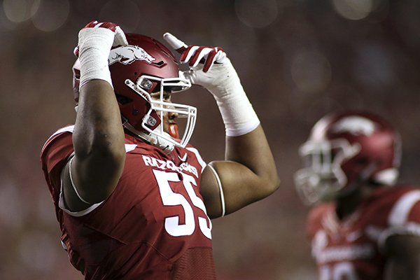 Arkansas' Jeremiah Ledbetter gestures to the crowd up during the second quarter of an NCAA college football game against Texas State on Saturday, Sept. 17, 2016, in Fayetteville, Ark. Arkansas won 42-3. (AP Photo/Samantha Baker)