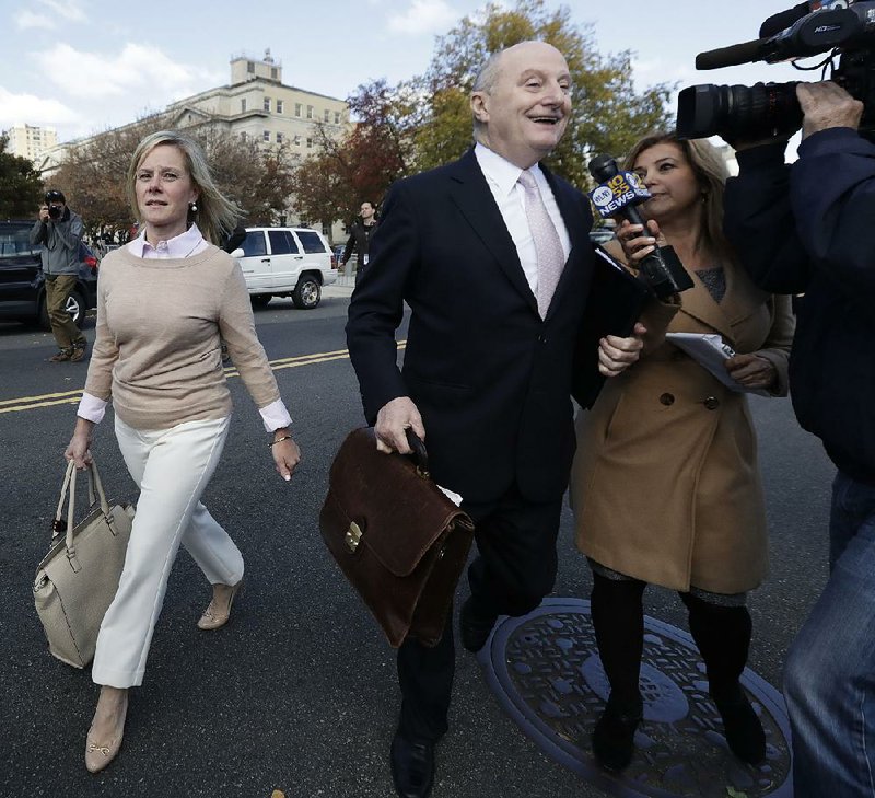A convicted Bridget Anne Kelly, former deputy chief of staff to New Jersey Gov. Chris Christie, walks Friday with her lawyer, Michael Critchley, in Newark, N.J. Kelly plans to appeal. 