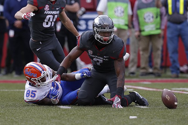 Arkansas running back Damon Mitchell looks for the ball after forcing a fumble during a game against Florida on Saturday, Nov. 5, 2016, in Fayetteville. 