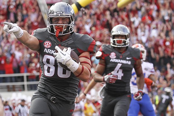 Arkansas receiver Drew Morgan (80) celebrates after scoring a touchdown during the second quarter of a game against Florida on Saturday, Nov. 5, 2016, in Fayetteville. 