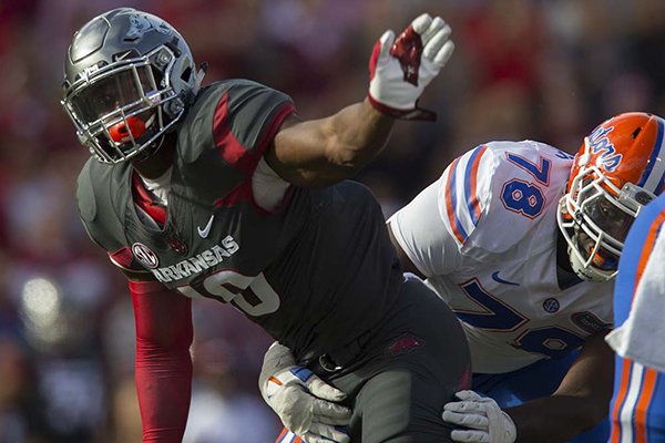 Arkansas defensive end Randy Ramsey sacks Florida quarterback Luke Del Rio during a game Saturday, Nov. 5, 2016, in Fayetteville. 