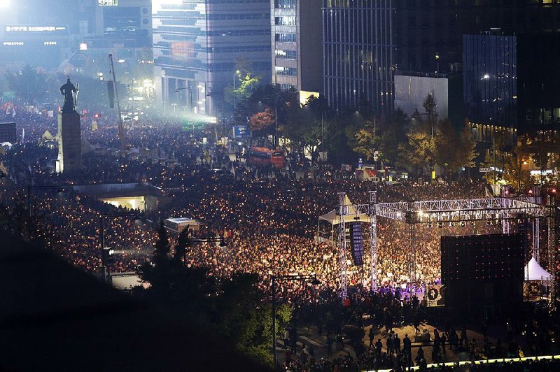 South Korean protesters hold a rally Saturday in Seoul to call for the resignation of President Park Geun-hye, who faces accusations that she allowed a confidante to meddle in state affairs. 