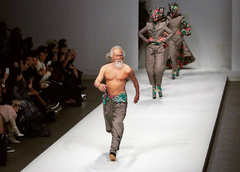Wang Deshun, who just turned 80, caused a national sensation with his bare-chested runway walk at the fall-winter 2015 China Fashion Week in Beijing. 