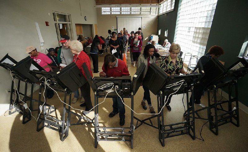 People cast their ballots in early voting Saturday at the Williams Library in downtown Little Rock. As of Friday, nearly 500,000 Arkansans had voted early, the secretary of state’s office said. 