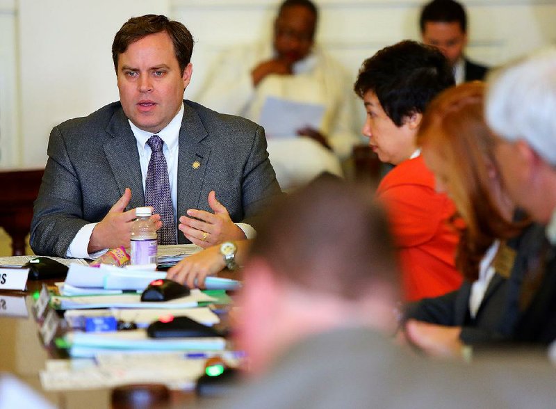 Sen. Jon Woods, R-Springdale, left, is shown in this file photo.