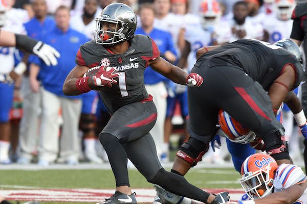 University of Arkansas receiver Jared Cornelius tries to get away from florida defender Cece Jefferson as he runs for a gain in the 4th quarter Saturday, November 5, 2016 during the Razorbacks 31-10 win at Razorback Stadium in Fayetteville.