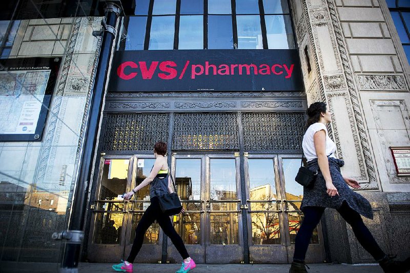 A CVS Health Corp. store is shown in Chicago on Sunday. The drugstore chain and pharmacy benefits manager on Tuesday posted a quarterly profit of $1.54 billion, or $1.43 per share. 