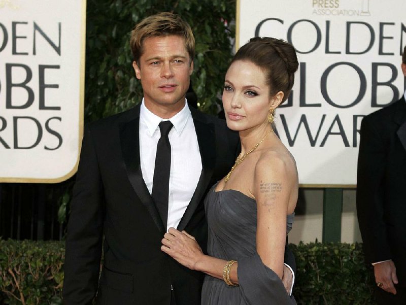 In this Jan. 15, 2007, file photo, actor Brad Pitt and actress Angelina Jolie arrive for the 64th Annual Golden Globe Awards in Beverly Hills, Calif. 