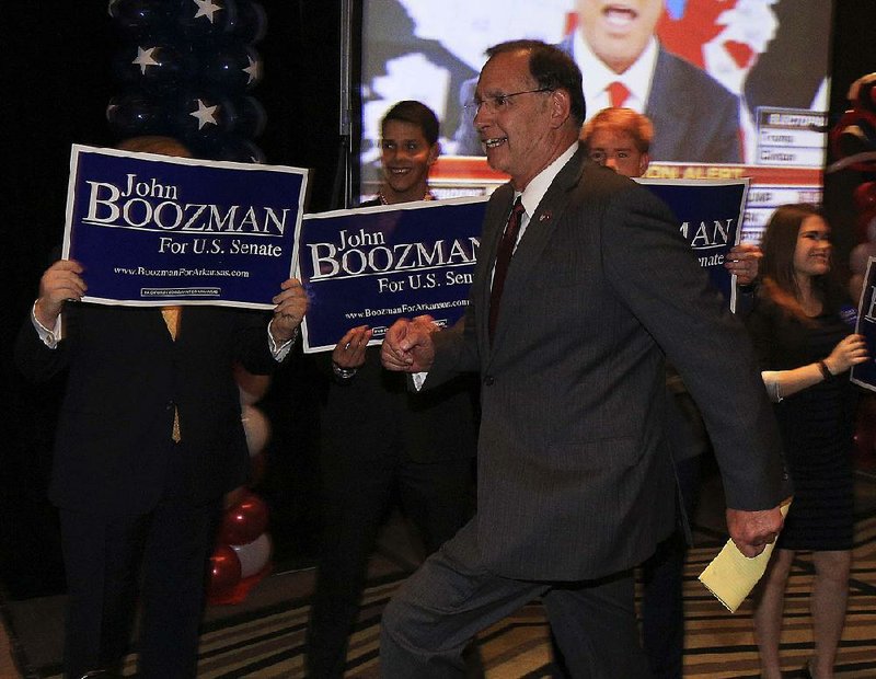 Sen. John Boozman celebrates his re-election Tuesday night at a Republican watch party in Little Rock.