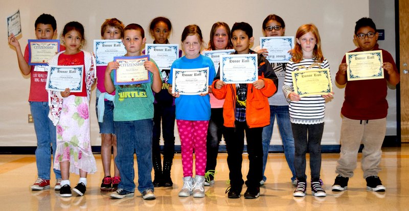 Photo by Mike Eckels Third grade students at Decatur Northside Elementary show off their honor roll certificates which they received during an assembly Oct. 20.