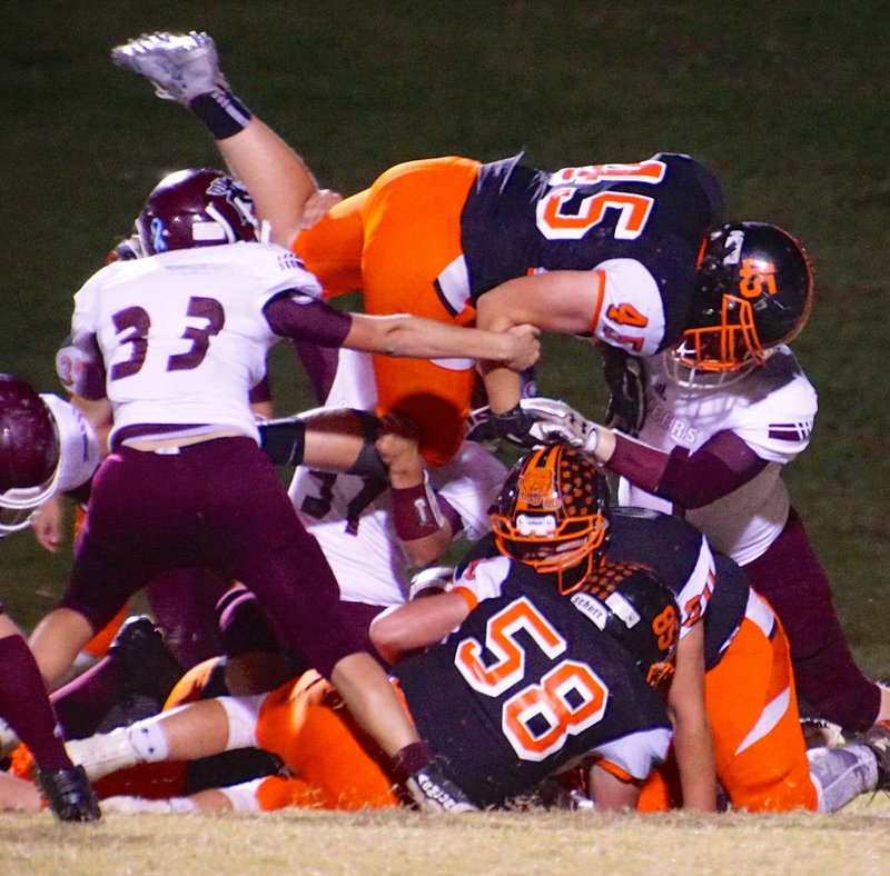 Photo by Randy Moll Bailey Soule&#8217; attempts to score for the Lions by diving over the Pioneer line during the game between the Gentry Pioneers and the Gravette Lions at Gravette on Friday, Nov. 4, 2016.