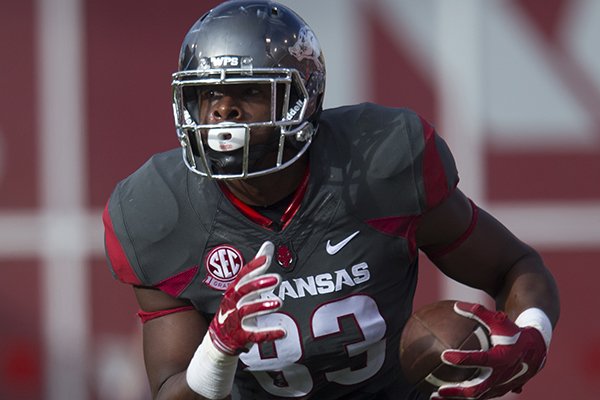 Arkansas tight end Jeremy Sprinkle runs after catching a pass during a game against Florida on Saturday, Nov. 5, 2016, in Fayetteville. 