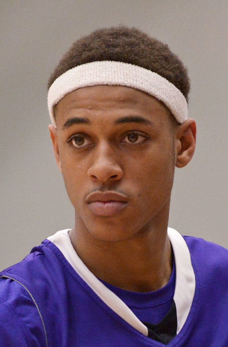 Daniel Gafford, El Dorado junior, warms up on Friday Jan. 22, 2016 before the game against Bentonville in Bentonville's Tiger Arena. 