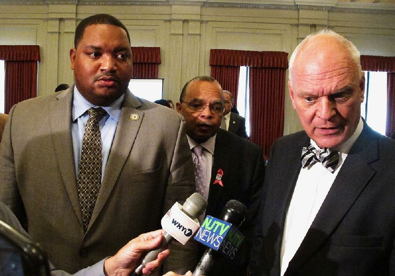 Atlantic City, N.J., councilmen Marty Small (left) and William Marsh stand with Mayor Don Guardian as he talks to reporters after an October hearing in Trenton on Atlantic City’s financial turnaround plan. 