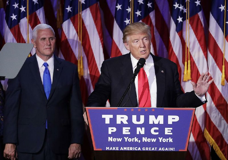 President-elect Donald Trump, with his running mate Mike Pence standing by, gives his acceptance speech in the early hours of Wednesday at a rally in New York. “Now it’s time for America to bind the wounds of division,” he said.