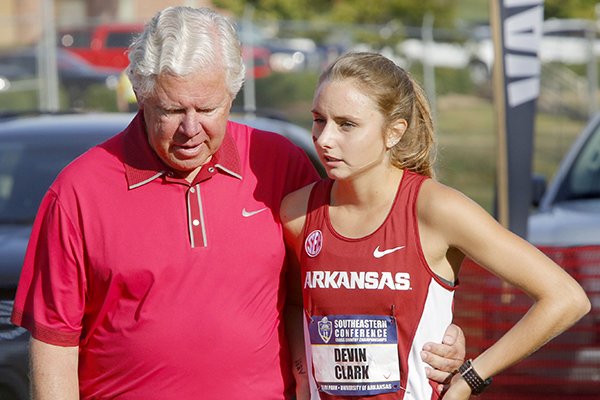Arkansas coach Lance Harter, left, talks with sophomore Devin Clark prior to the start of the SEC Cross Country Championship on Friday, Oct. 28, 2016, in Fayetteville. 