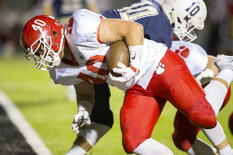 Cabot fullback Easton Seidl falls into the end zone for a touchdown during Thursday’s Class 7A first-round playoff game against Bentonville West at the Tiger Athlectic Complex in Bentonville. Seidl fi nished with 110 yards and 5 touchdowns on 16 carries.