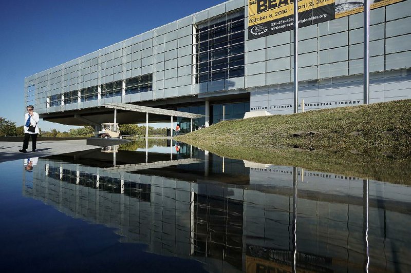 Arkansas Democrat-Gazette/MITCHELL PE MASILUN --11/10/2016--
The Clinton Presidential Center is reflected in the pool out front Thursday, November 10, 2016.  The Center will offer free admission for retired military personnel and their families on Veterans Day, and also offer free admission for everyone on Saturday, November 12, to commemorate the 12th anniversary of the Center's opening. 