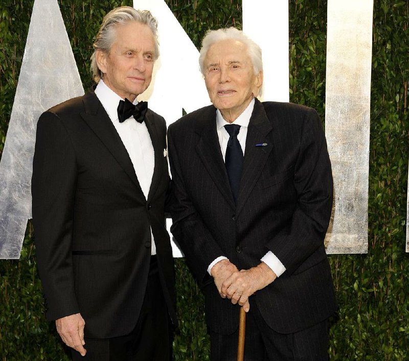  In this Feb. 26, 2012 file photo, Michael Douglas, left, and Kirk Douglas arrive at the Vanity Fair Oscar party in West Hollywood, Calif. 