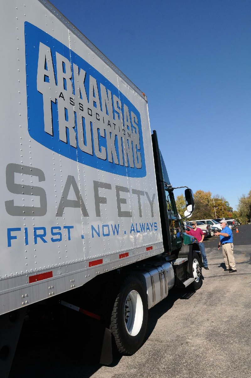 Rogers Heritage High School students learn about the trucking industry and safe driving during the Share the Road program taught by Arkansas truck drivers. 