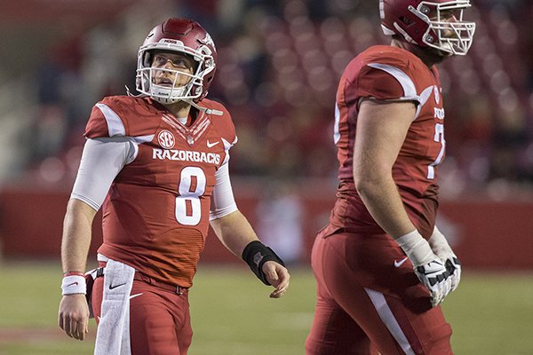 Arkansas quarterback Austin Allen walks off the field after throwing an interception during a game against LSU on Saturday, Nov. 12, 2016, in Fayetteville. 