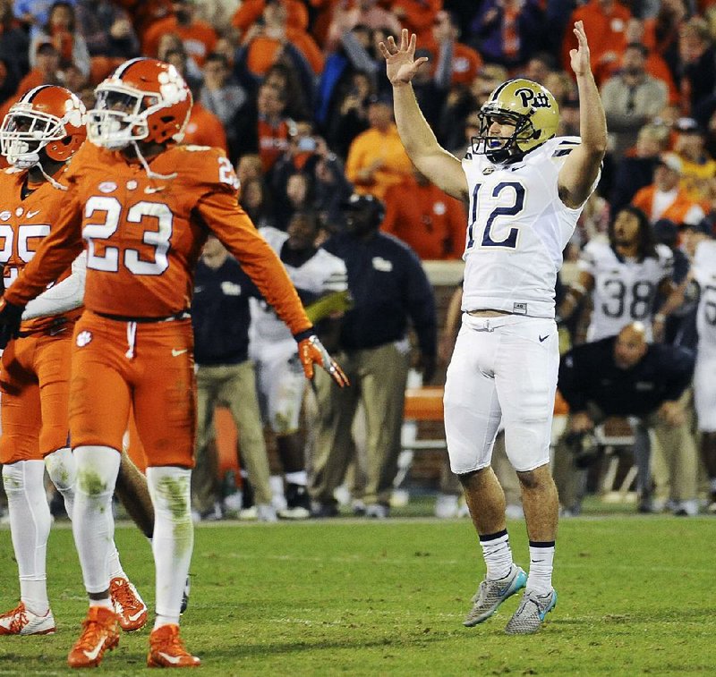 Pittsburgh’s Chris Blewitt (12) signals his reaction after kicking the game-winning 48-yard field goal with 6 seconds remaining, giving the Panthers a 43-42 victory over No. 2 Clemson on Saturday in Clemson, S.C. 