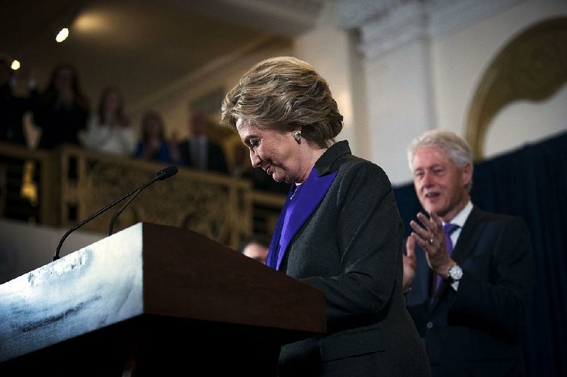 Former President Bill Clinton lends support Wednesday as Hillary Clinton gives her concession speech in New York. “Nationally, Ms. Clinton didn’t do well with white working-class people, and Arkansas is filled with white working-class people,” Arkansas Democratic Party spokesman H.L. Moody said.