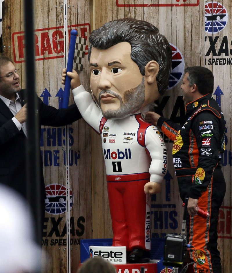 NASCAR Sprint Cup driver Tony Stewart (above), who plans to retire after this season, was presented with a giant bobblehead during last week’s driver introductions at Texas Motor Speedway in Fort Worth.