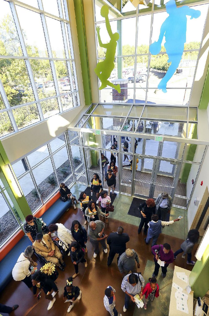 Visitors tour the new West Central Community Center in Little Rock during Saturday’s grand opening. The new $6.4 million facility is equipped for a variety of sports and community activities. 