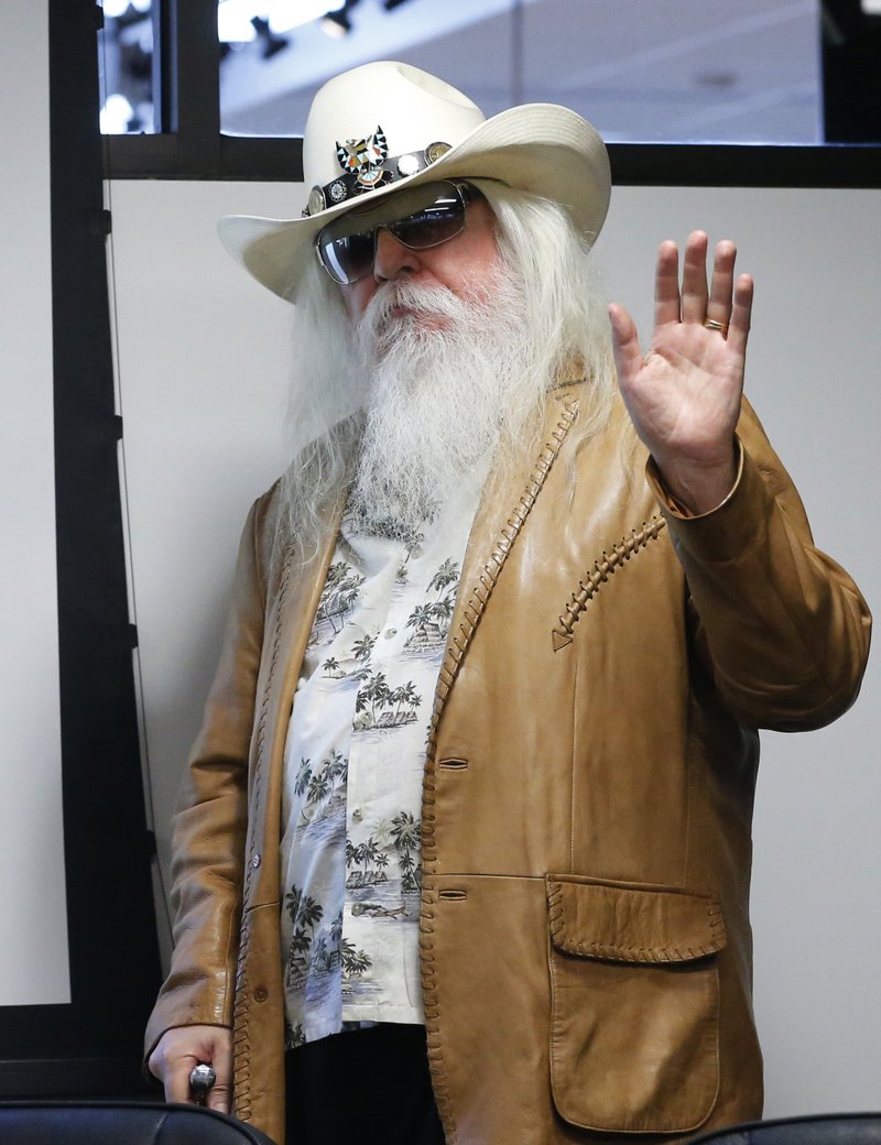 FILE - In this Jan. 29, 2013, file photo, Leon Russell waves as he is introduced in Tulsa, Okla. Russell, who sang, wrote and produced some of rock 'n' roll's top records, has died.